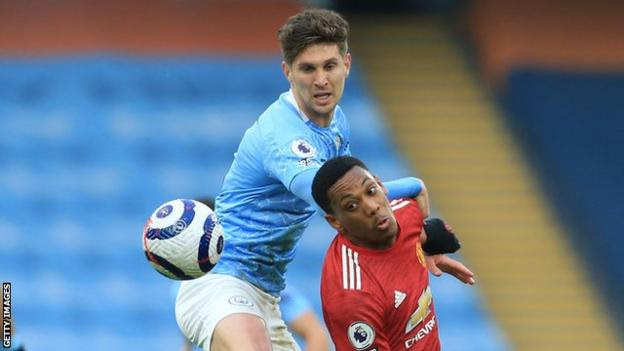 Manchester City defender John Stones in action against Manchester United in the Premier League in 2020-21
