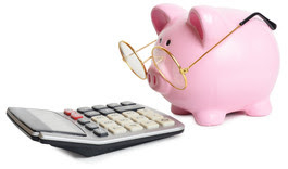 image of a calculator and a piggy bank