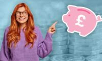 woman pointing at piggy bank in front of pound coins