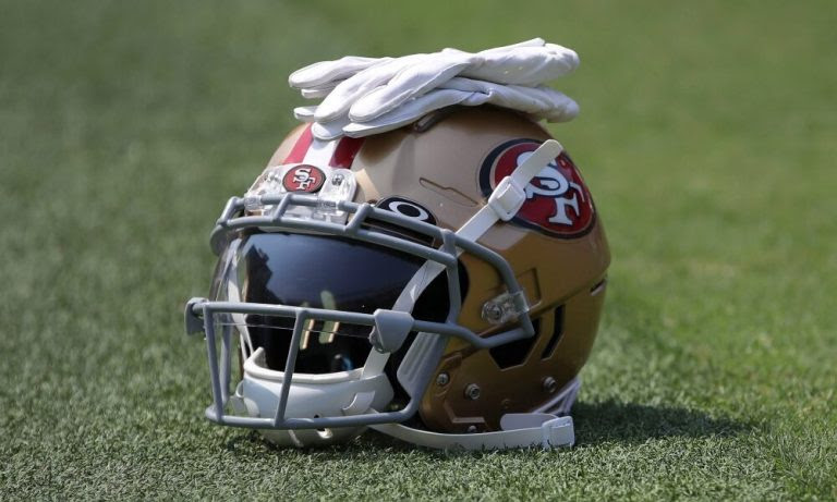 49ers helmet laying on the turf