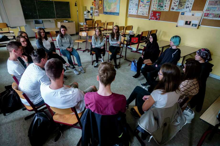 In this Monday, June 25, 2018, photo, Laura Schulmann, center right, and Sophie Steiert, center left, listen to questions from students about Jewish daily life in Germany during a lesson as part of a project about religions at the Bohnstedt Gymnasium high school in Luckau, Germany.&nbsp; Photo: Markus Schreiber / Copyright 2018 The Associated Press. All rights reserved.