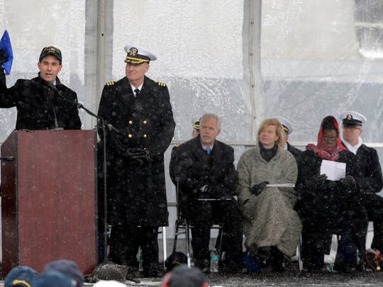 Wisconsin Gov. Scott Walker, left, presents a Wisconsin