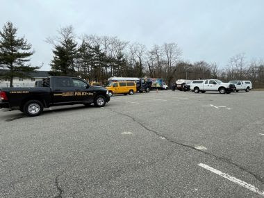 ECO vehicle in a parking lot with other trucks during checkpoint