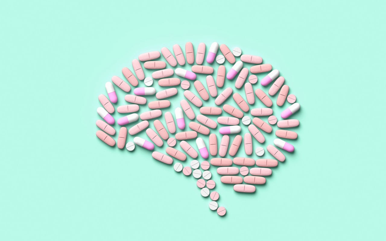 An illustration showing tablets arranged in the shape of a brain