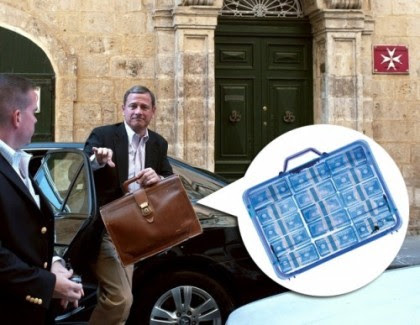 roberts with suitcase of money