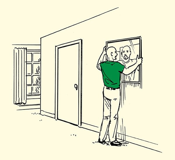 man placing mirror on wall in home illustration