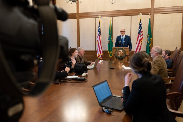 Gov. Jay Inslee announces his proposed budget for the 2023-25 biennium during a Wednesday press conference.