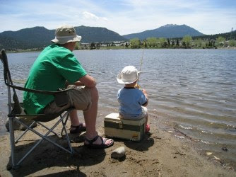 Father and son on the shore fishing