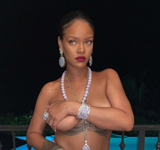Rihanna poses topless in sexy poolside snap