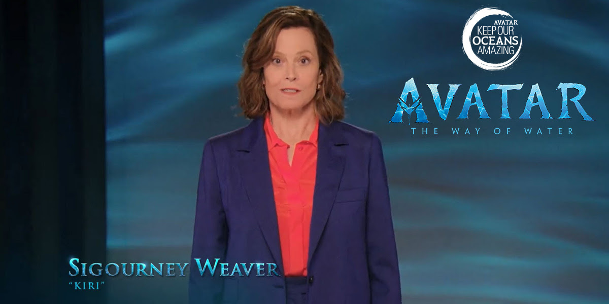 Photo of actor Sigourney Weaver against a blue backdrop with logo from Disney's Avatar. © undefined