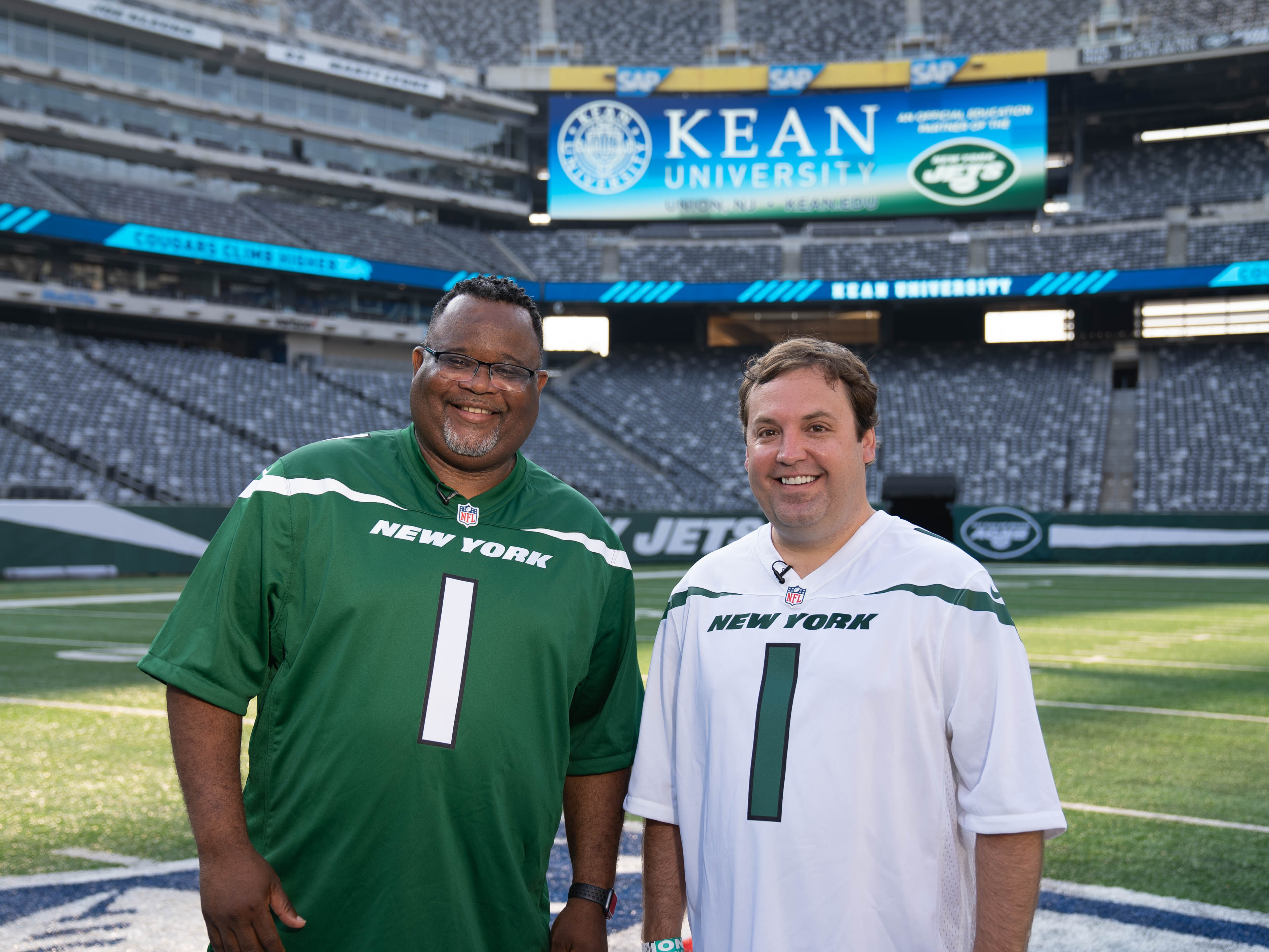 Kean University President Lamont O. Repollet, Ed.D., and Kean Foundation CEO Bill Miller on the field at MetLife Stadium.