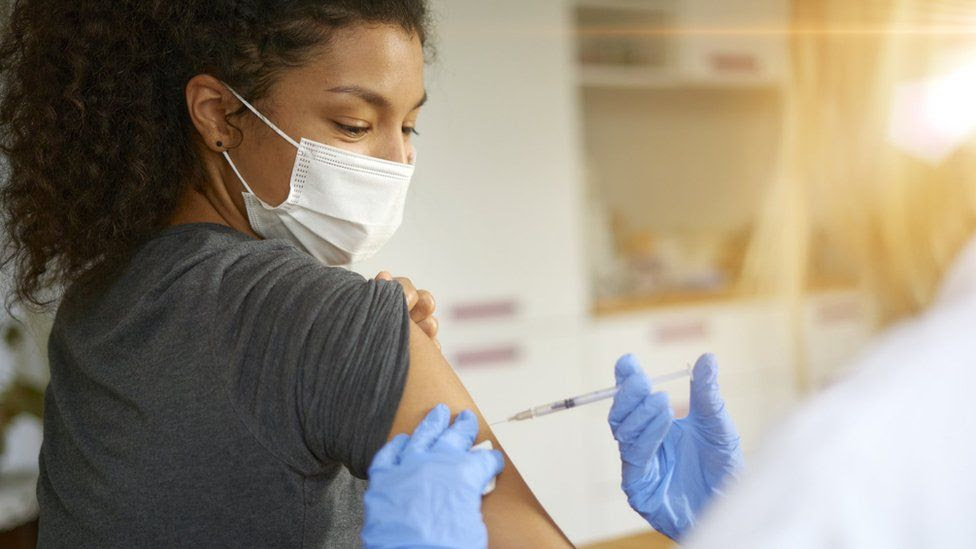 Woman being vaccinated