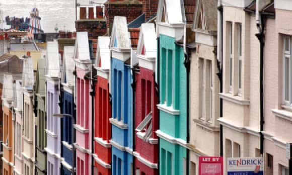 Brightly multicoloured painted terraced houses in Blaker Street Brighton, East Sussex.