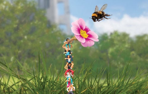A tower of people work together to help a bee (c) Slinkachu (2020)