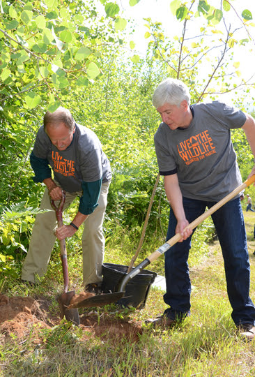 Creagh and Snyder plant trees at GEMS trail