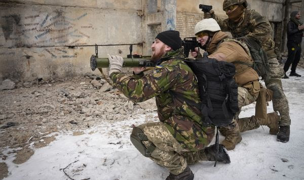 Local residents attend the all-Ukrainian training campaign &quot;Don&#39;t panic! Get ready!&quot; close to Kyiv, Ukraine, Sunday, Feb. 6, 2022. Russia has denied any plans of attacking Ukraine, but urged the U.S. and its allies to provide a binding pledge that they won&#39;t accept Ukraine into NATO, won&#39;t deploy offensive weapons, and will roll back NATO deployments to Eastern Europe. Washington and NATO have rejected the demands. (AP Photo/Efrem Lukatsky)