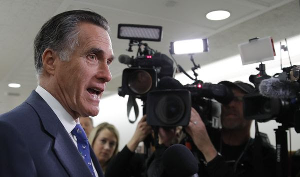 Sen. Mitt Romney, R-Utah, speaks to media as he arrives for a briefing on Capitol Hill in Washington, Thursday, March, 12, 2020, on the coronavirus outbreak. (AP Photo/Carolyn Kaster) **FILE**