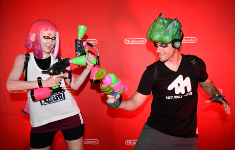 In this photo provided by Nintendo of America, cosplayers Heidi O’Ferrall and Leo Camacho celebrate ...