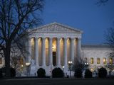 In this Jan. 22, 2020, file photo, Night falls on the Supreme Court in Washington. (AP Photo/J. Scott Applewhite, File)