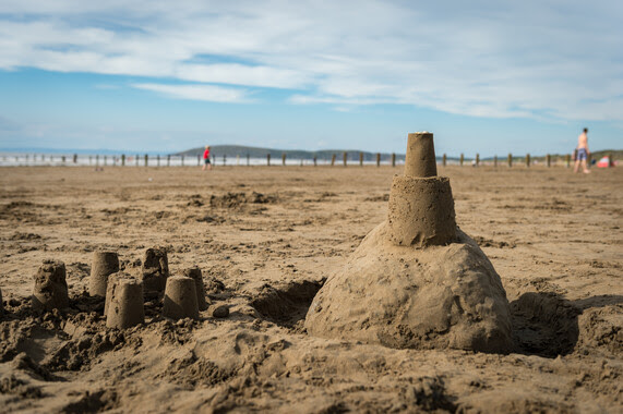 image of sandcastle on the beach