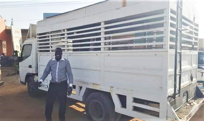 The Rev. Philemon Hassan Kharata with Baptist church truck confiscated in 2012. (Facebook)