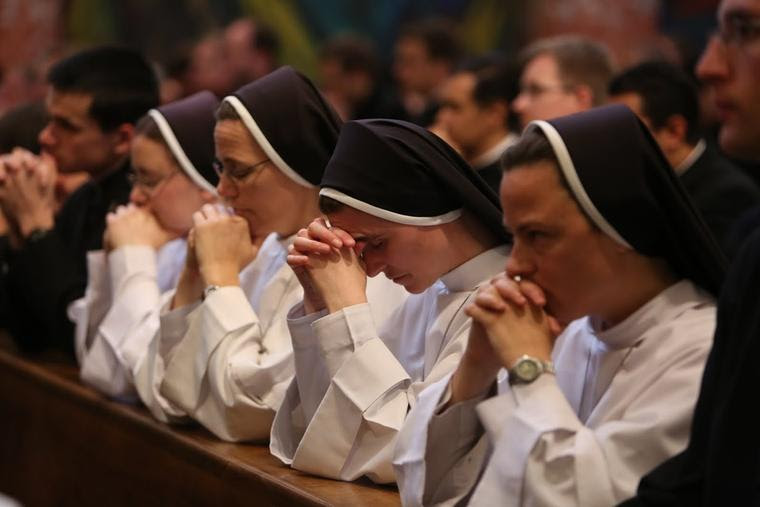 Nuns pray during Mass celebrated by Pope Francis at the Pontifical North American College in Rome, May 2, 2015.