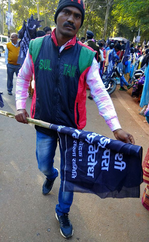  Tribal activist carrying black flag the day before Christmas in Jharkhand state, India. (Morning Star News)