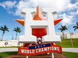 A sign outside the Houston Astros&#39; spring training facility in West Palm Beach, Florida, bears the words &quot;2017 World Series Champions.&quot; The Astros were punished after an investigation found they used a system of cameras and banging on trash cans to decode and relay opposing pitchers&#39; signs to their batters at the plate. (Photo by All-Pro Reels / Ed Sheahin)