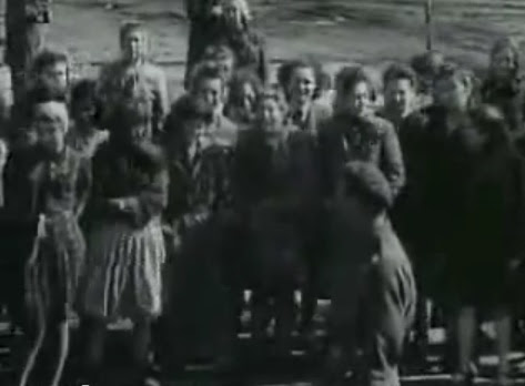 Public with emotions watching the lorry                             full of emaciated dead bodies coming                             probably from the Rhine meadow camps (12min.                             48sec.)