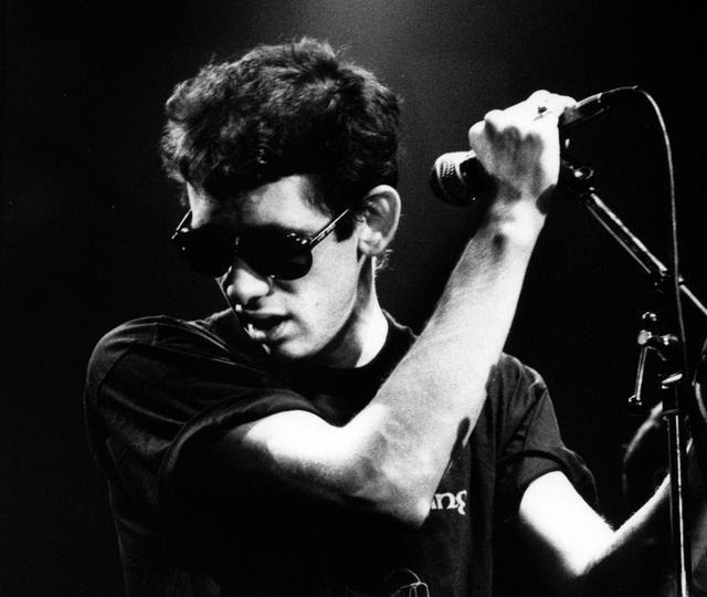 Shane MacGowan with a microphone