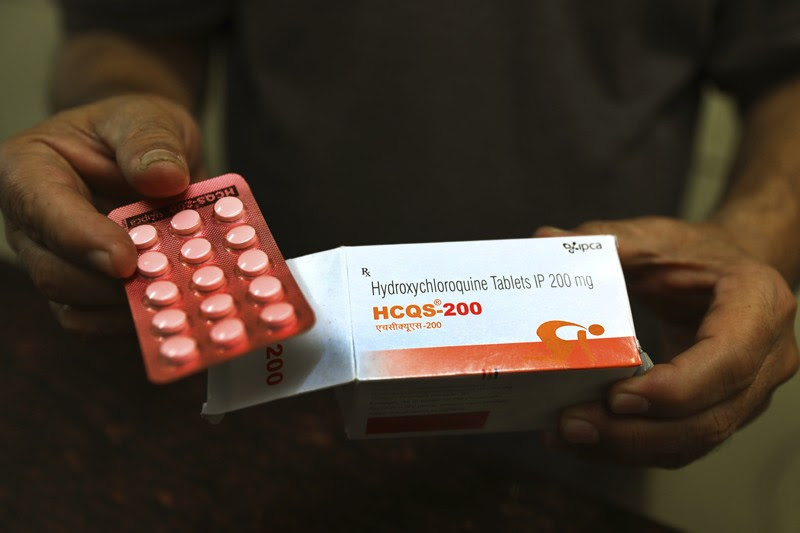 A chemist displays hydroxychloroquine tablets in New Delhi, India