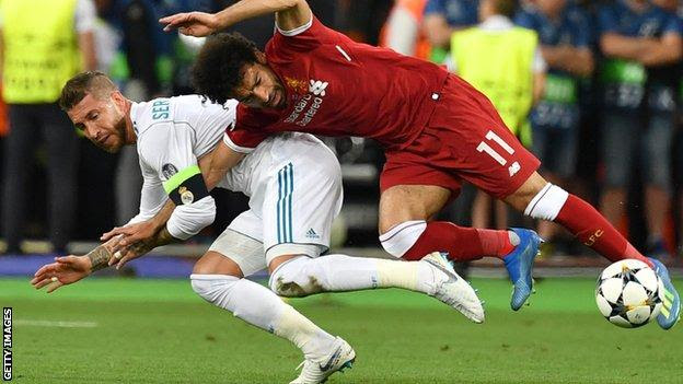 Liverpool forward Mohamed Salah had to go off with a shoulder injury after a challenge with Sergio Ramos during the first half of the 2018 Champions League final against Real Madrid