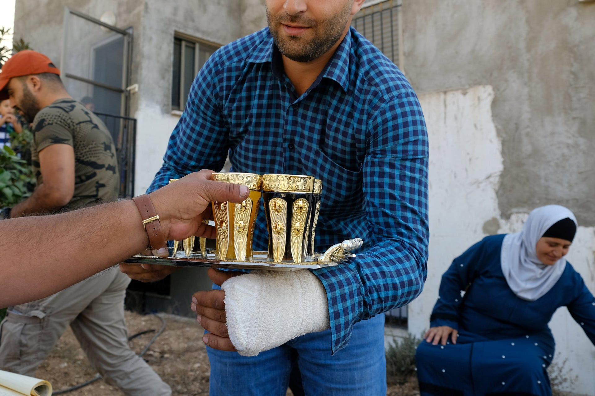 One of Imad Zaben's sons, who asked his name not be used, his hand in a cast.