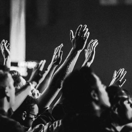 Group with hands raised in worship