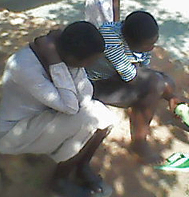 Two daughters, 22 and 17, mourn the death of their father, Yokannah Zirinkuma. (Morning Star News)