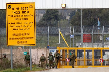 Israeli soldiers stand guard at the Quneitra border crossing between Israel and Syria, shortly after the U.S. recognized Israeli sovereignty over the disputed Golan Heights region, March 23, 2019.