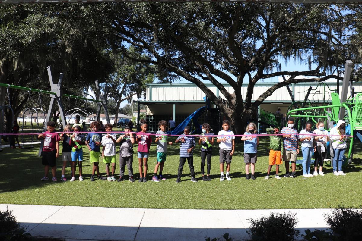 Mango Parks & Recreation Center diverse kids cutting opening ribbon