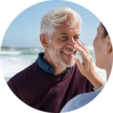 image - mom applying sunscreen to son