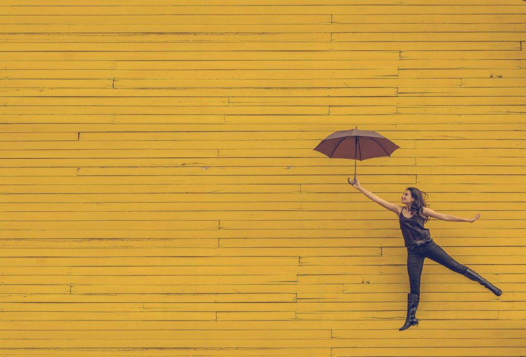 Inner Beauty_Girl leaping with umbrella