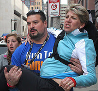 Man carrying injured woman