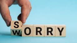 Sorry to worry hand turns a cube and changes the word worry to sorry business concept copy space