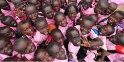 Photo of about two dozen children of South Sudan