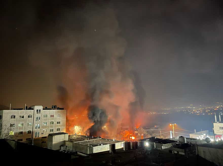 Burning houses in Hawara, in the West Bank on Sunday night