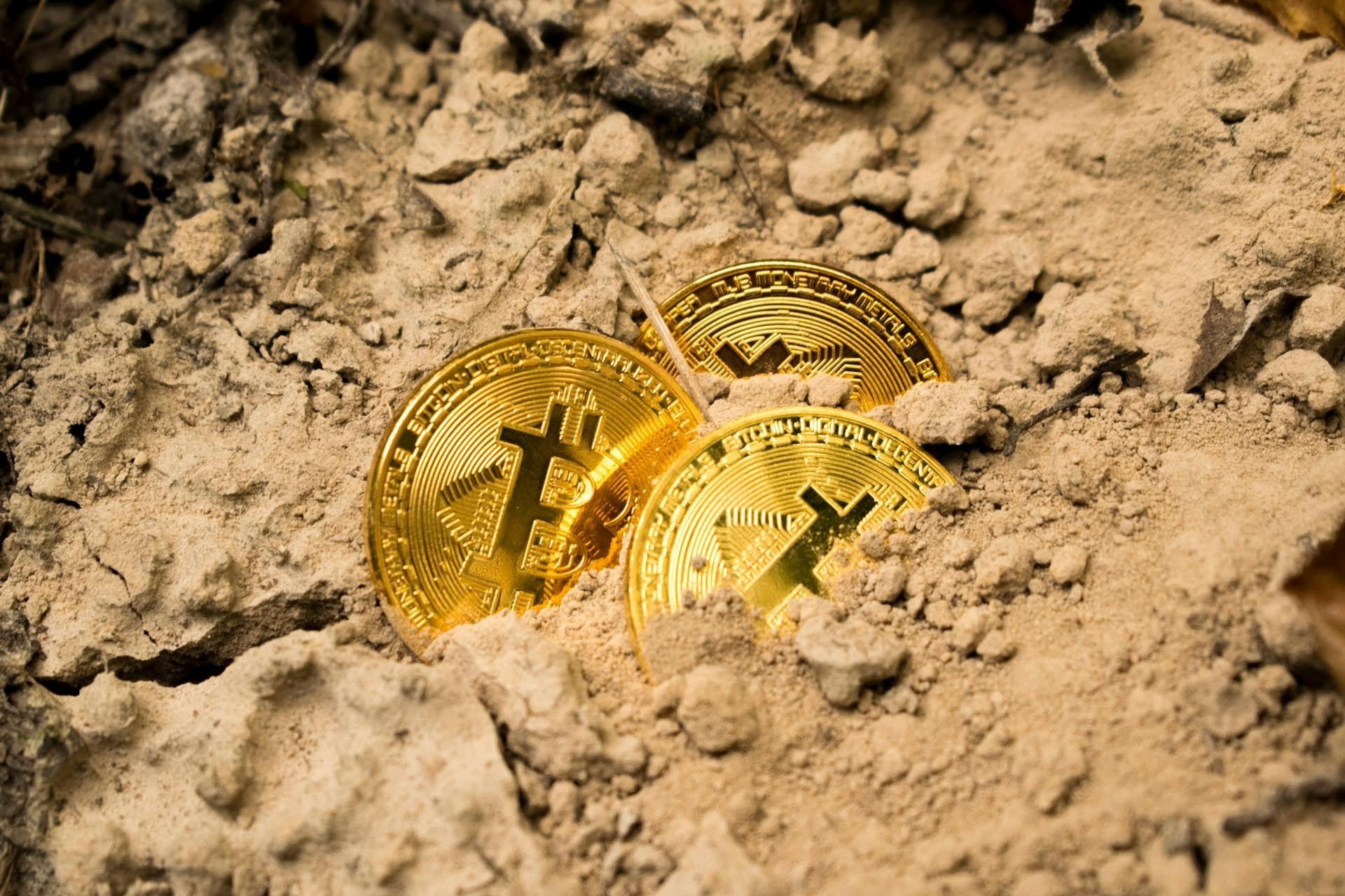 bitcoin in sand