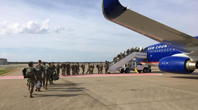 Troops prepare to depart from Fort Campbell, Ky.,