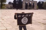 Demonstrator holds ISIS flag on the ancient plaza of the Temple Mount in Jerusalem's Old City.