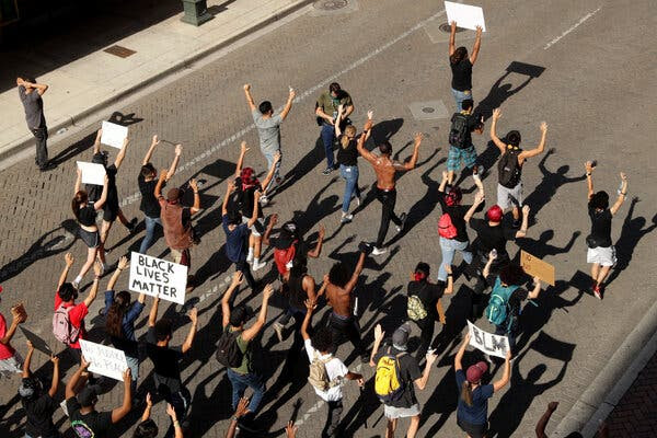Protesters chanting
              "Hands up, don't shoot" in San Antonio last
              June, soon after the killing of George Floyd.