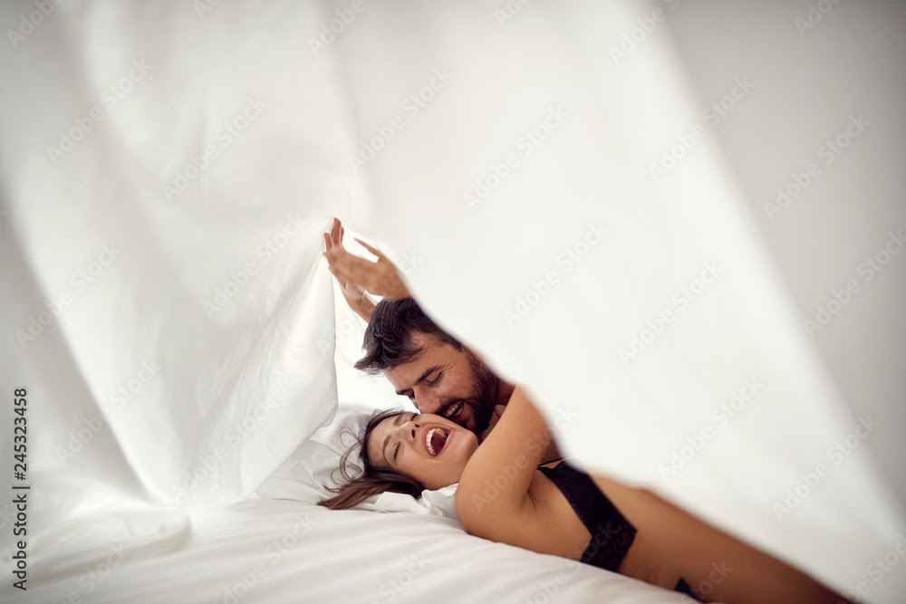 Passionate happy couple making love in bed- Passionate sex. Stock Photo |  Adobe Stock
