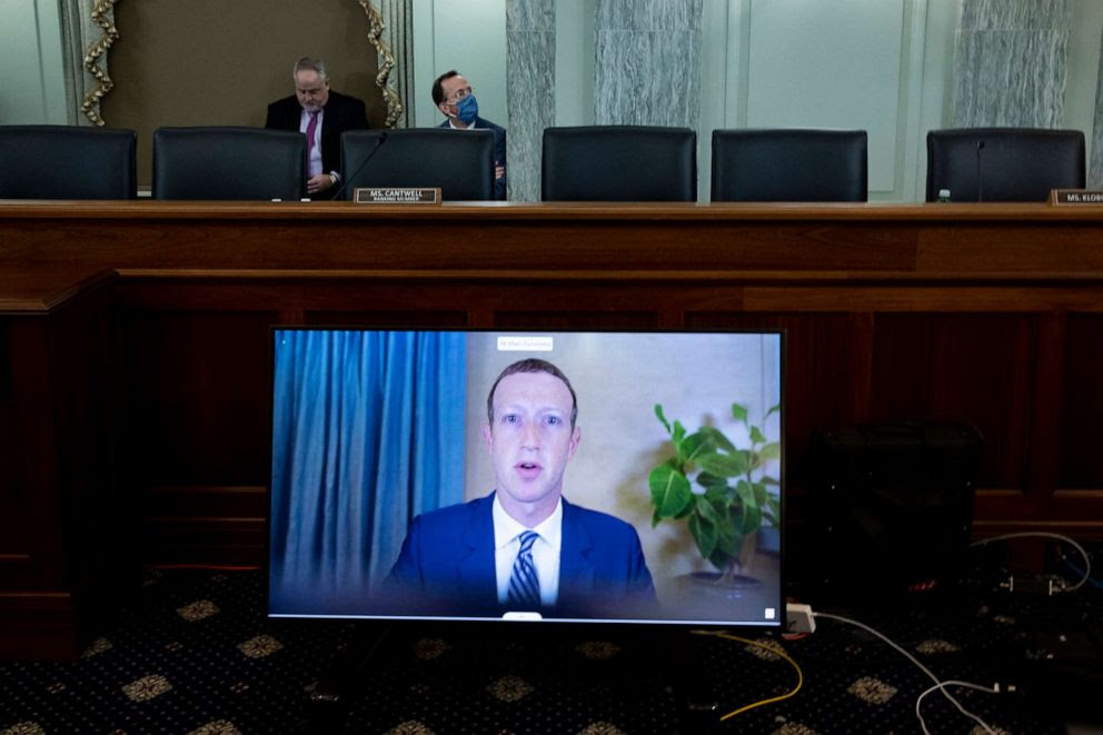 PHOTO: CEO of Facebook Mark Zuckerberg appears on a monitor as he testifies remotely during the Senate Commerce, Science, and Transportation Committee hearing on Capitol Hill, Oct. 28, 2020.