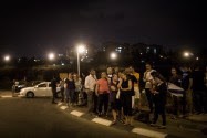 Residents of Jerusalem's Armon Hanatziv neighborhood protest at the traffic circle at the entrance Tzur Baher, where Alexander Levlovitz was murdered by Arab terrorists.